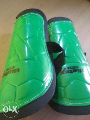 Pair Of Green Leather Slide Sandals