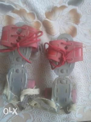 Pair Of Red-and-gray Roller Blades