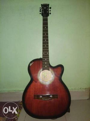 Red And Black Cutaway Acoustic Guitar