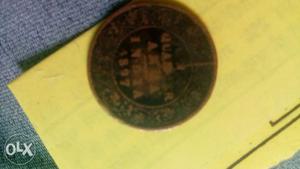 Round Black-and-brown Indian Coin