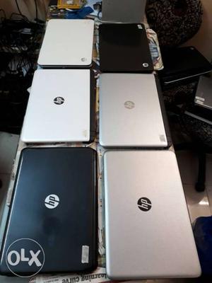 Several Gray And Black HP Laptops