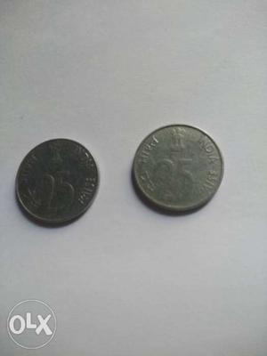 Two Silver-colored 25 Indian Paise Coins