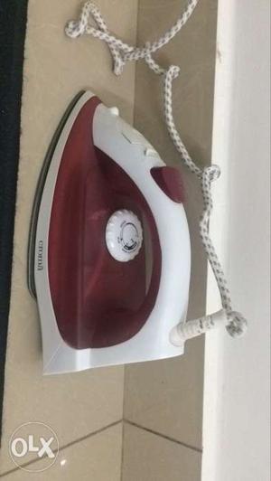 White And Maroon Steam Clothes Iron