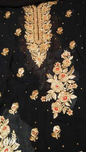 Black, Yellow, And Red Floral Textile