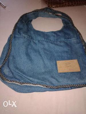 Denim material compact bag...very easy to carry..