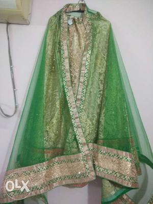 Golden lehenga with green duppata and golden