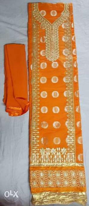 Orange And Golden Floral Textile