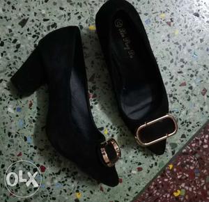 Pair Of Black Suede Heeled Shoes
