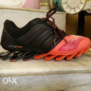 Pair Of Black-and-orange Adidas Springblade Shoes