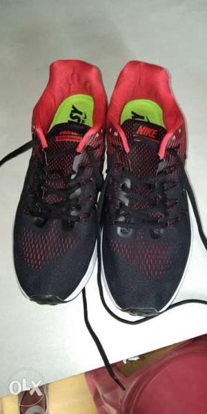 Pair Of Black-and-pink Nike Running Shoes