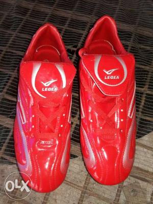 Pair Of Red Nike Cleats