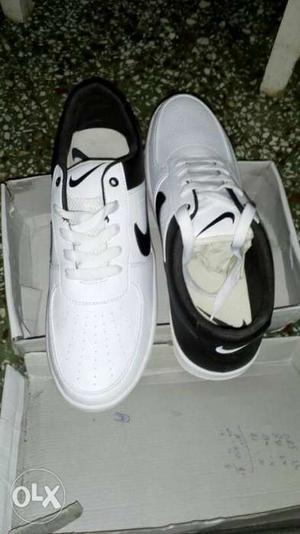 Pair Of White Nike Low-top Sneakers