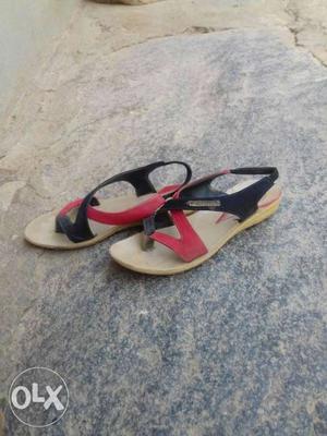 Pair Of White-black-and-red Sandals