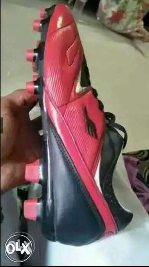 Paired Black And Red Cleats