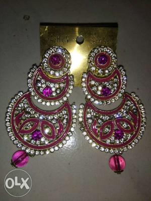 Pink diamond earrings call me: