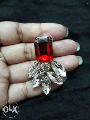 Silver-colored Earring With Red Gemstone