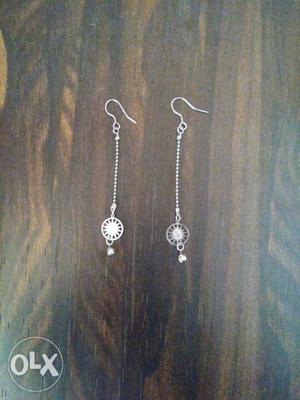 Silver coloured hanging earrings