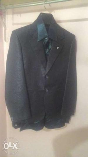 Unused black shining blazer with shining gray shirt for