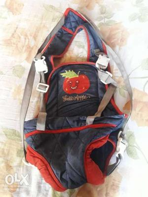 Baby carrier blue and red colour.