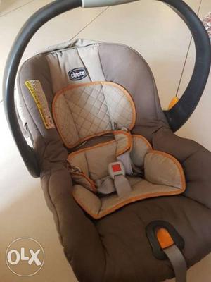 Baby's Gray And Brown Car Seat Carrier