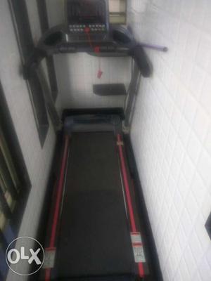 Black And Red Automatic Treadmill