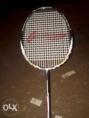 Black, Red, And White Badminton Racket