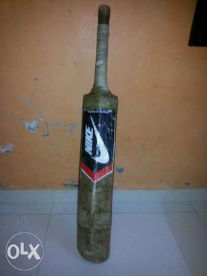 Brown, Black, And White Nike Cricket Bat