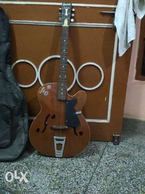 Brown colour guitar of givson company. E string