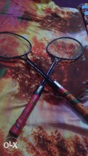 Two Black-and-pink Badminton Rackets