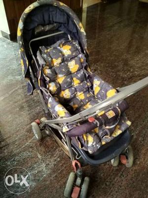 Baby's Black And Yellow Stroller
