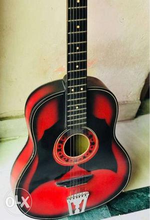 Black and red acoustic guitar for sale..very less