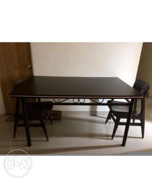 Dining table in excellent condition with three chairs