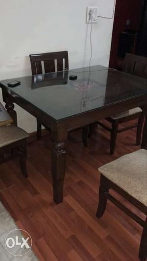 Dinning table with 4 chairs. 1 year old. minor