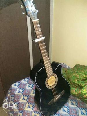 Granada acoustic guitar with cover and capo
