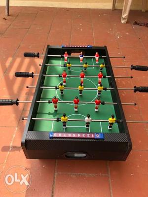 Green And Brown Foosball Table