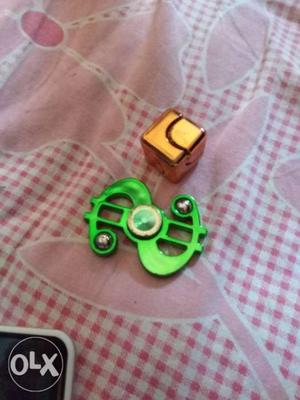 Green Dollar Sign Hand Spinner And Gold Fidget Cube