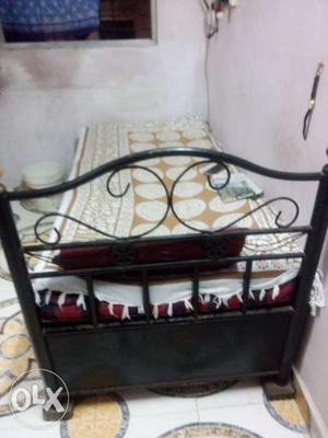 Hard metal black bed in good condition..