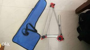 Red mini drafter with blue bag and drawing clips
