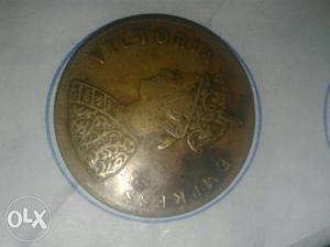 Round Gold-colored Victoria Coin