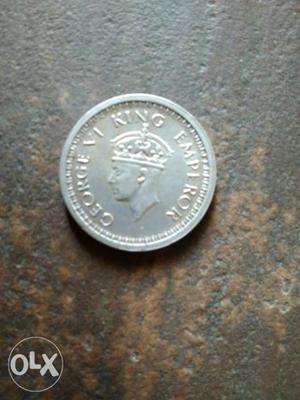 Round Silver-colored Emperor George Coin