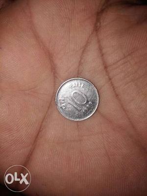 Silver colour 10 paisa coin 