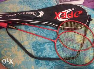 Two Red Opex Badminton Rackets