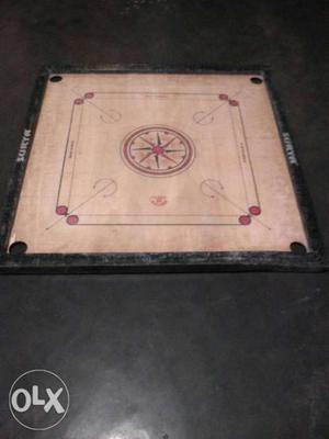 White And Black Wooden Carrom Board