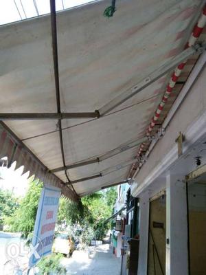 White And Red Striped Awning