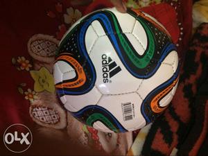 White, Blue, And Green Adidas Soccer Ball