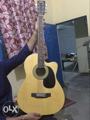 Yellow Cutaway Acoustic Guitar