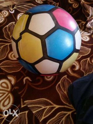 Yellow, White, Blue, And Red Soccer Ball