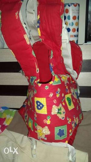 Baby's Red And Multicolored Carrier