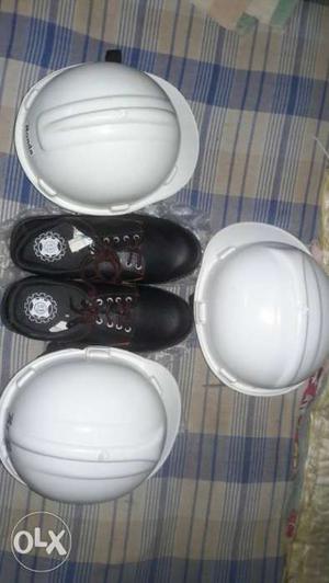 Black colour shoes num 8 With 3 safety helmets