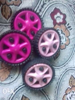 Four Black-and-pink Plastic Caster Wheels